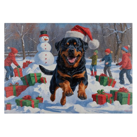 Rottweiler läuft im Schnee mit Weihnachtshut Schneidebrett (Vorderseite)
