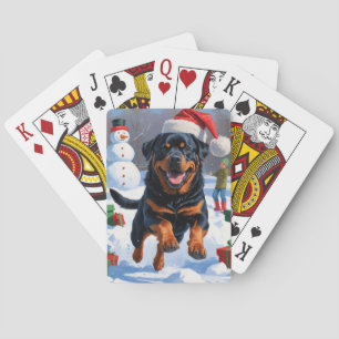 Rottweiler läuft im Schnee mit Weihnachtshut Spielkarten