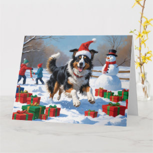 Rough Collie läuft im Schnee mit Weihnachtshut Karte