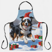 Rough Collie läuft im Schnee mit Weihnachtshut Schürze (Vorderseite)
