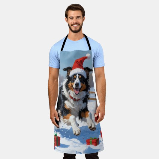 Rough Collie läuft im Schnee mit Weihnachtshut Schürze (Getragen)