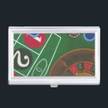 Roulettetisch mit Chips und Rädern Visitenkarten Dose<br><div class="desc">Das Spinnrad hält den ganzen Power auf dem Roulettetisch,  aber der Power dieses Gemäldes liegt in der lebensechten Darstellung einer Casinoszene. Das Grün des Filzes und die Farbe der Chips bringt Sie am Tisch,  wartend auf Ihrem Einsatz,  um sich auszuzahlen. Kaufen Sie Ihr Exemplar dieses phantastischen Drucks noch heute!</div>