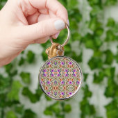 Round keychain featuring intricate floral patterns schlüsselanhänger (Hand)