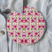 Round wall clock with a vibrant floral design button (Beispiel)