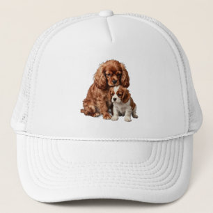 Ruby Cavalier Spaniel und ihr Blenheim-Welpe Truckerkappe