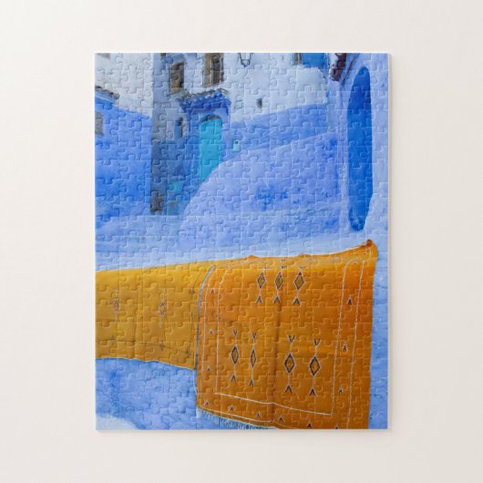 Rugs auf einer blauen Mauer Puzzle (Vertikal)