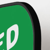 Ruheständig spielen Pickleball Paddle und Ball (Linke Seite)