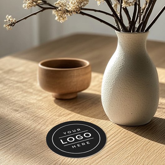 Rund um das Logo für "Schwarze Unternehmen" Runder Pappuntersetzer