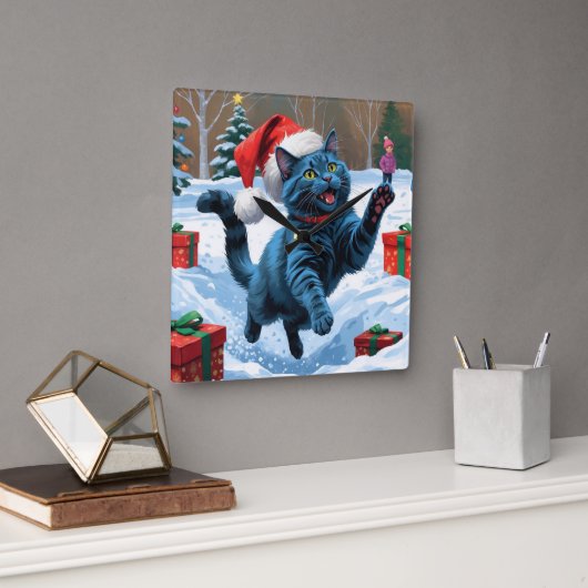 Russische blaue Katze mit Weihnachtsmütze Quadratische Wanduhr (Büro)
