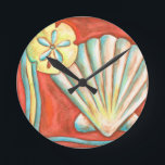 Rustic Orange Seashells Runde Wanduhr<br><div class="desc">Lay out on the warm sand and find the hidden treasures! This painting by Nancy Slocum captures the beautiful water life found ashore. It captures the a beautiful orange seashell,  an orange starfish,  and a vibrant blue sand dollar. Get your beautiful ocean art today on your next Zazzle product.</div>