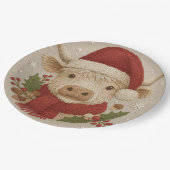 Rustikale Hochlandkuh mit Weihnachtsmannmütze Pappteller (Schrägansicht)