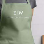 Sage Green Elegant Moderner Minimalistischer Monog Schürze<br><div class="desc">Erleben Sie kulinarische Erlebnisse mit unserer klassischen Elegant Moderne Minimalistische Monogram Name Cooking Schürze. Diese Küche ist unverzichtbar und vereint zeitlose Eleganz mit zeitgemäßem Minimalismus. Diese Schürze ist nicht nur ein praktisches Accessoire, sondern auch eine persönliche Note. Mit der individuell anpassbaren Monogramm- und Namensoption können Sie Ihre Persönlichkeit in Ihre...</div>