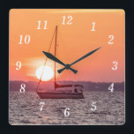Sailboat Sunrise Wall Uhr<br><div class="desc">Wall Clock - Die Sonne Pop in der Mitte eines Segelbootes Mast entlang Santa Rosa Sound in Navarra Florida, Vereinigte Staaten. Der Himmel füllt sich mit orangen und korallenfarbenen Farben, die als goldene Zauberstunde oder goldene Stunde bekannt sind. Suchen Sie weitere Drucke oder Produkte? Fühlen Sie sich frei, um meinen...</div>