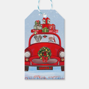 Saint Bernard Hund in Auto mit dem Weihnachtsmann Geschenkanhänger