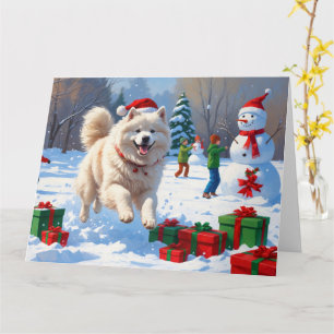 Samoyed Running in Snow mit Weihnachtshut Karte