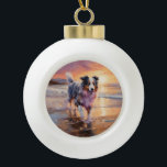 Sandy Australian Shepherd Dog on Beach Sunset Keramik Kugel-Ornament<br><div class="desc">Tauchen Sie ein in die ruhige Schönheit unseres Hundes "Sandy Paws and Sunset Hues" mit Sonnenuntergang am Strand. Diese faszinierende Szene vereint das Wesen eines perfekten Abends am Ufer, mit einem treuen Hund, der den goldenen Sand und die atemberaubenden Farben der untergehenden Sonne genießt. Ob Hundeliebhaber oder Sonnenuntergang - dieses...</div>