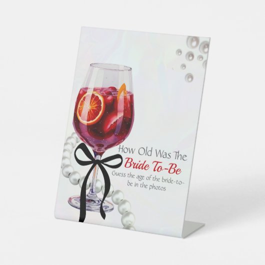 Sangria & Sass "Raten Sie das Zeitalter der Braut" Sockelschild (Vorderseite)