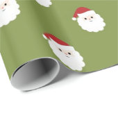 Sankt stellt auf grünem WeihnachtsPackpapier Geschenkpapier (Rolleneckpunkt)