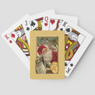Santa am Fenster mit Spielzeugsack Gold Spielkarten