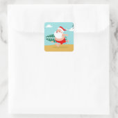 Santa at beach cartoon quadratischer aufkleber (Tasche)