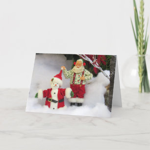 Santa baut einen Schneemann! Weihnachtskarte Feiertagskarte