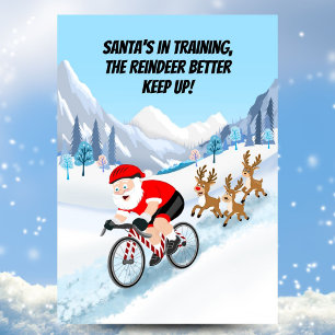 Santa beim Radfahren mit Rentieren Postkarte