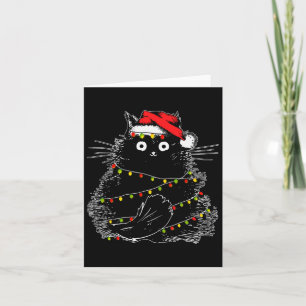 Santa Black Cat hallte in Weihnachtsbaumlicht auf Karte