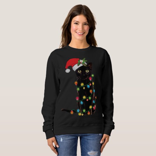 Santa Black Cat hallte in Weihnachtsbaumlicht auf Sweatshirt (Vorne ganz)