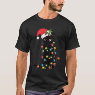 Santa Black Cat hallte in Weihnachtsbaumlicht auf T-Shirt