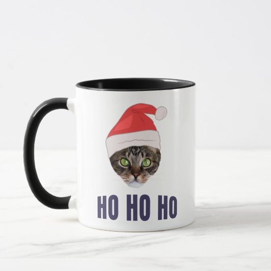 Santa Cat mit Weihnachtsmannmütze, Ho Ho ho Einlad Tasse (Links)