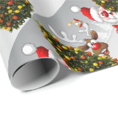 Santa claus and reindeer behind a christmas tree.j geschenkpapier (Rolleneckpunkt)