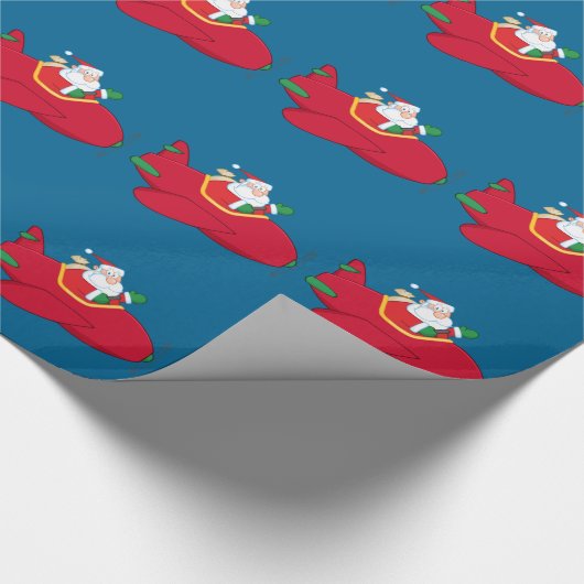 Santa-Claus-Flying-a-Flugzeug-and-Waving Geschenkpapier (Ecke)