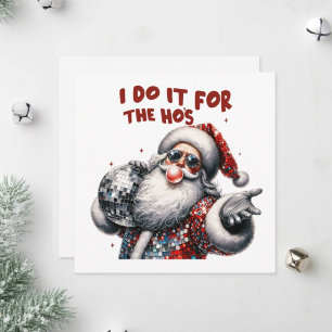 Santa Claus hält eine funkelnde Disco-Kugel. Feiertagskarte