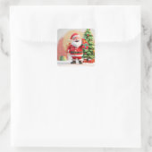 Santa Claus Holding anwesend Quadratischer Aufkleber (Tasche)