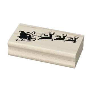 Santa Claus mit seinem Schlitten und Rentier Gummistempel