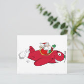 Santa Flying mit Weihnachts-Flugzeug Feiertagspostkarte (Stehend Vorderseite)