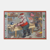 Santa in seiner Werkstatt, Frohe Weihnachten, Fußmatte (Vorderseite)
