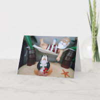 SANTA NIMMT EINE BREITE "CHRISTMAS"-KARTE