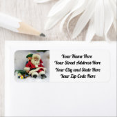 Santa nimmt einen Tumble-Rücksendeadressen-Aufkleb (Insitu)