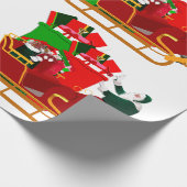 Santa packt sein Geschenkschleppe-Wrap-Papier Geschenkpapier (Ecke)