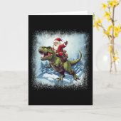 Santa reitet auf einem Dinosaurier T-Rex Lustiges  Karte (Gelbe Blume)