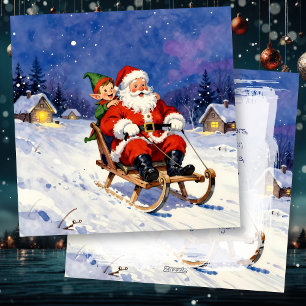 Santa und Elf beim Schlittenfahren am Heiligen Abe Feiertagskarte