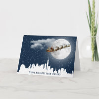 Santa und Sleigh fliegen über die Skyline der Groß
