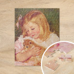 Sara Holding a Cat | Mary Cassatt Puzzle<br><div class="desc">Sara Holding a Cat (1908) von der amerikanischen Impressionistin Mary Cassatt. Die originelle Kunstmalerei stellt ein Portrait eines kleinen Mädchens dar,  das ein rosa Kleid trägt und ein Kätzchen hält. Verwenden Sie die Entwurfstools,  um einen benutzerdefinierten Text hinzuzufügen oder das Bild zu personalisieren.</div>