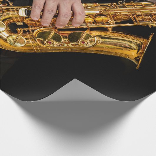 Saxophone Player gibt sächsischen Jazzspieler aus Geschenkpapier (Ecke)