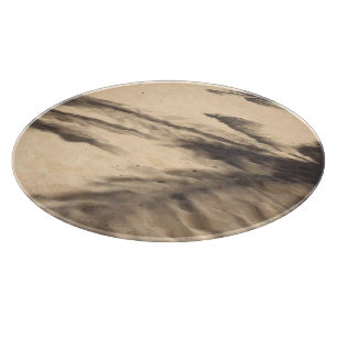 Schatten auf dem Sand Schneidebrett