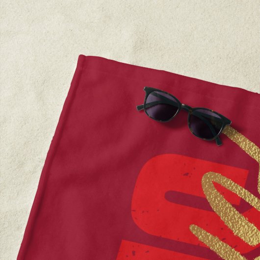 SCHAZAM! Götterwut | Logo für die goldene Markieru Strandtuch (Beispiel)