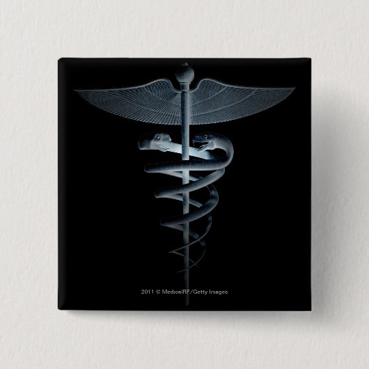 Scheinwerfer auf einem medizinischen Caduceus Button (Vorderseite)