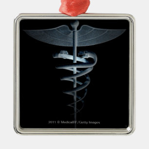 Scheinwerfer auf einem medizinischen Caduceus Silbernes Ornament