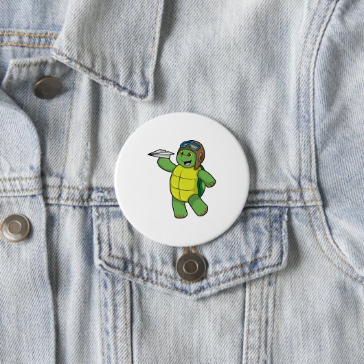 Schildkröte als Pilot mit Papier-Flugzeug Button (Beispiel)